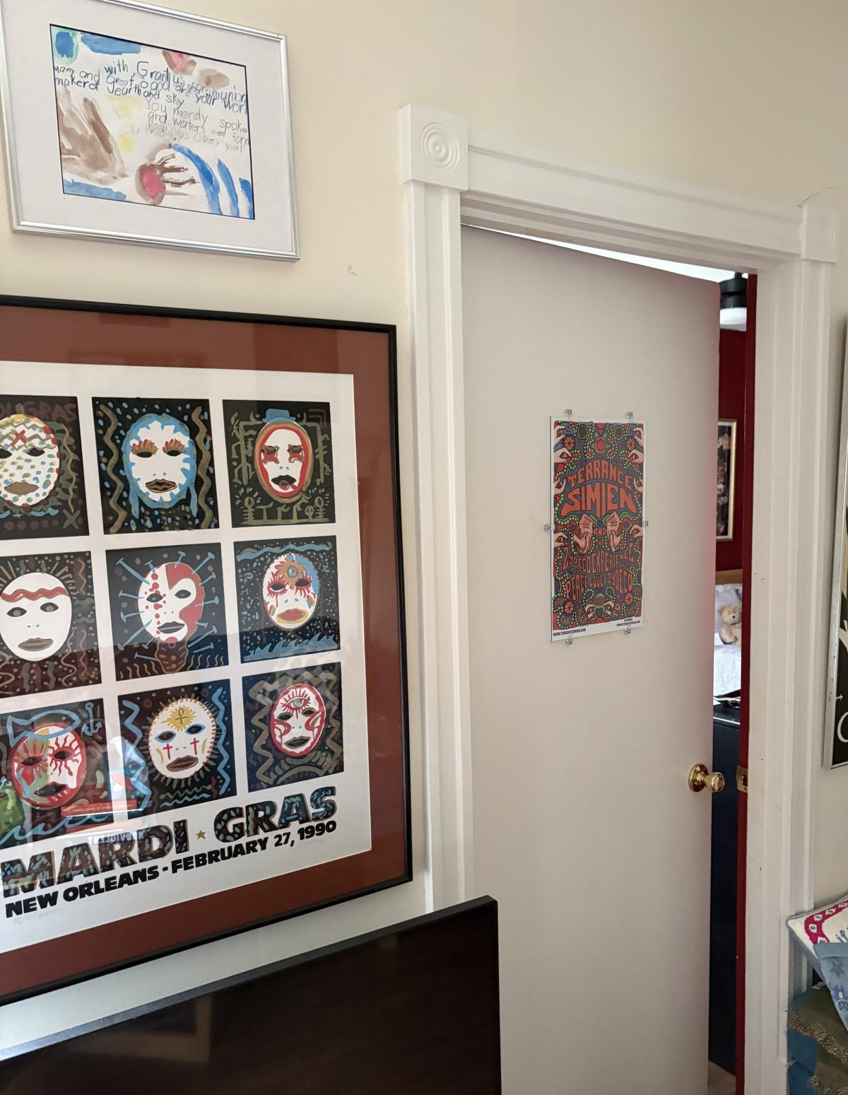 Hallway inside the Naturally Memphis home with a gallery wall of local artwork